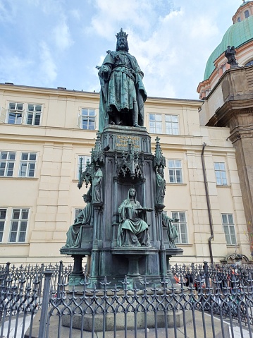 Prague, Czech Republic - June 9, 2023: Statue of Charles IV outside St. Francis Of Assisi Church in the morning.