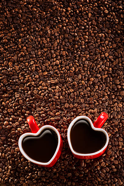 This is a photo of 2 heart shaped coffee cups sitting in a pile of coffee beans. There is a lot of space above for copy.Click on the links below to view lightboxes.