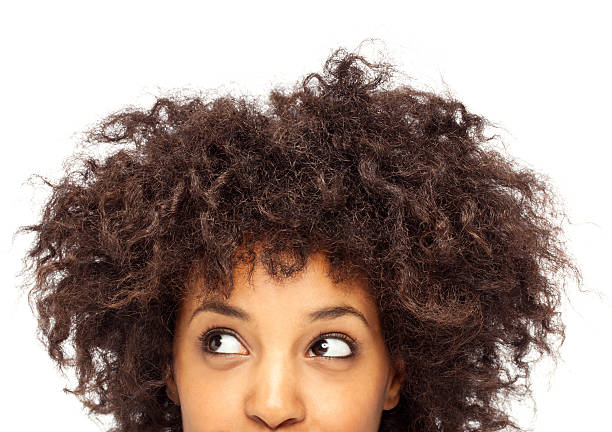 istock Woman peeking behind blank sheet 174810721