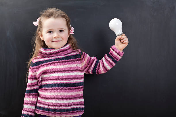 istock Cute girl in front of a chalkboard 174810975