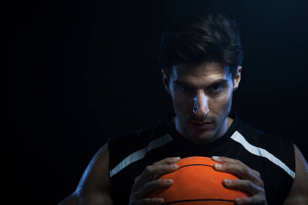 istock Basketball player portrait on black background, horizontal. 174811075