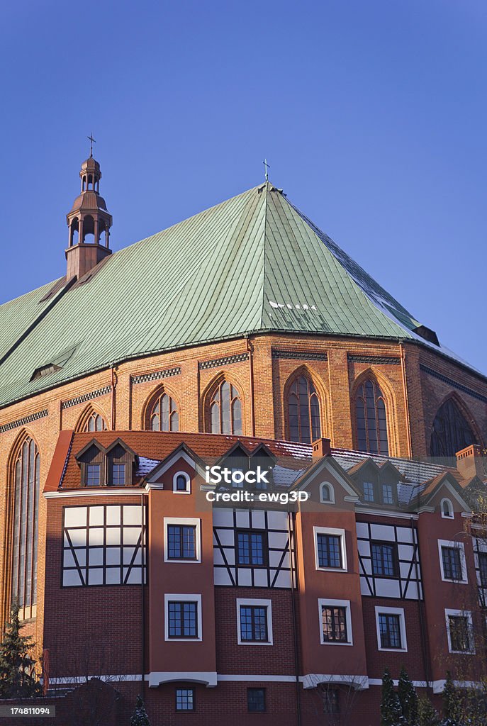 Cathedral Basilica of St. Jacob "Cathedral Basilica of St. Jacob is the most important church in Szczecin, Poland. Cathedral is located on the European Route of Brick Gothic. In this photo is back view of Cathedral and modern apartment houses. See more HISTORICAL BUILDINGS images here:" Apartment Stock Photo