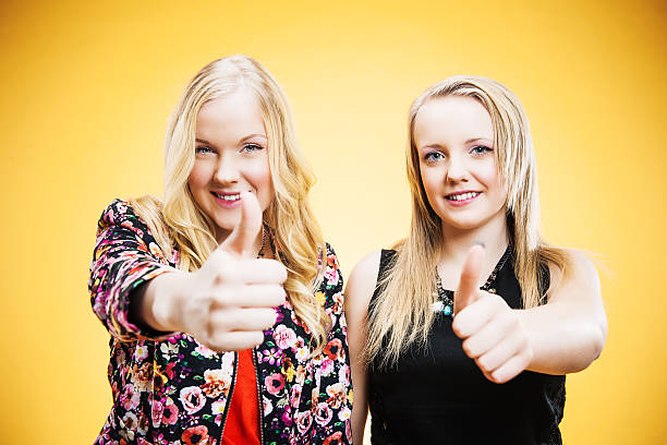 istock Cute teenagers doing thumbs up 174811260