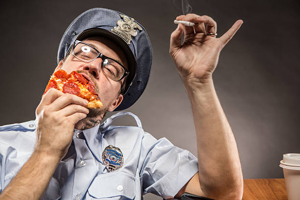 cop auf kurzurlaub - humor badge blue crime stock-fotos und bilder