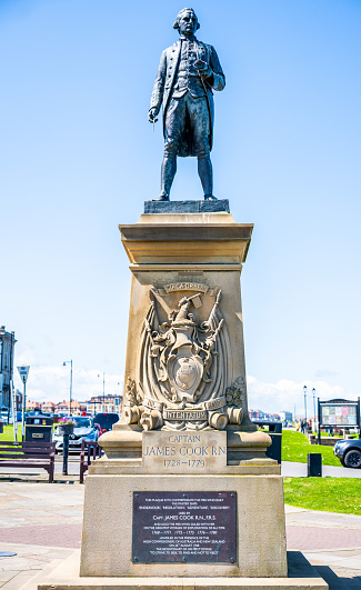 Whitby, United Kingdom, May 15, 2023: A bronze memorial to explorer Captain Cook (1728-1779) which looks out from the west cliff of Whitby, Yorkshire.