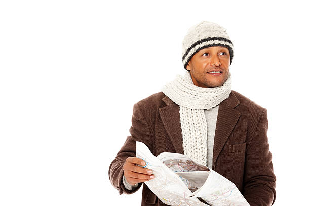 istock African mature man holding a map and looking away 174812159