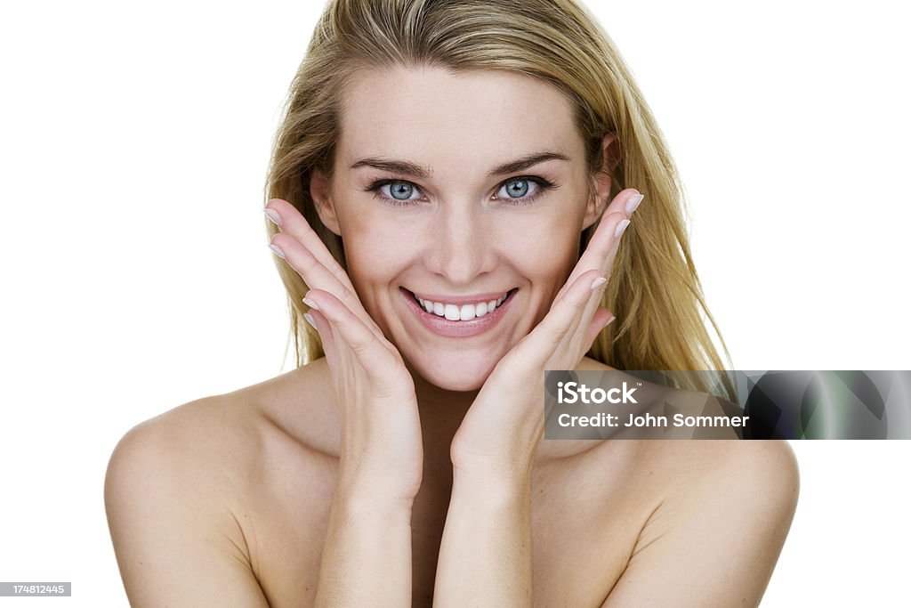 Skincare concept Horizontal composition of a beautiful blond woman touching her face  Blond Hair Stock Photo