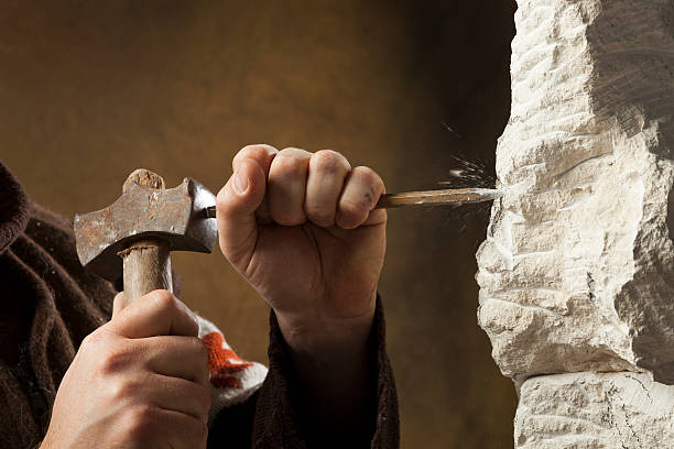 Stone carver's hands Stone carver's hands, sculptor stock pictures, royalty-free photos & images