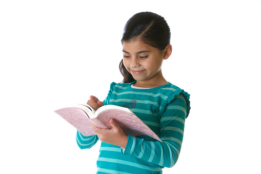 Latin american Little girl  reading the Bible or book