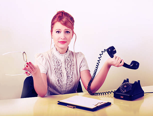 istock Vintage style office worker on the phone 174812820