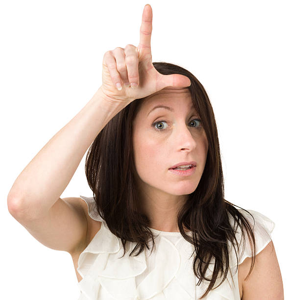 istock Woman Gives Loser L Hand Sign 174812865