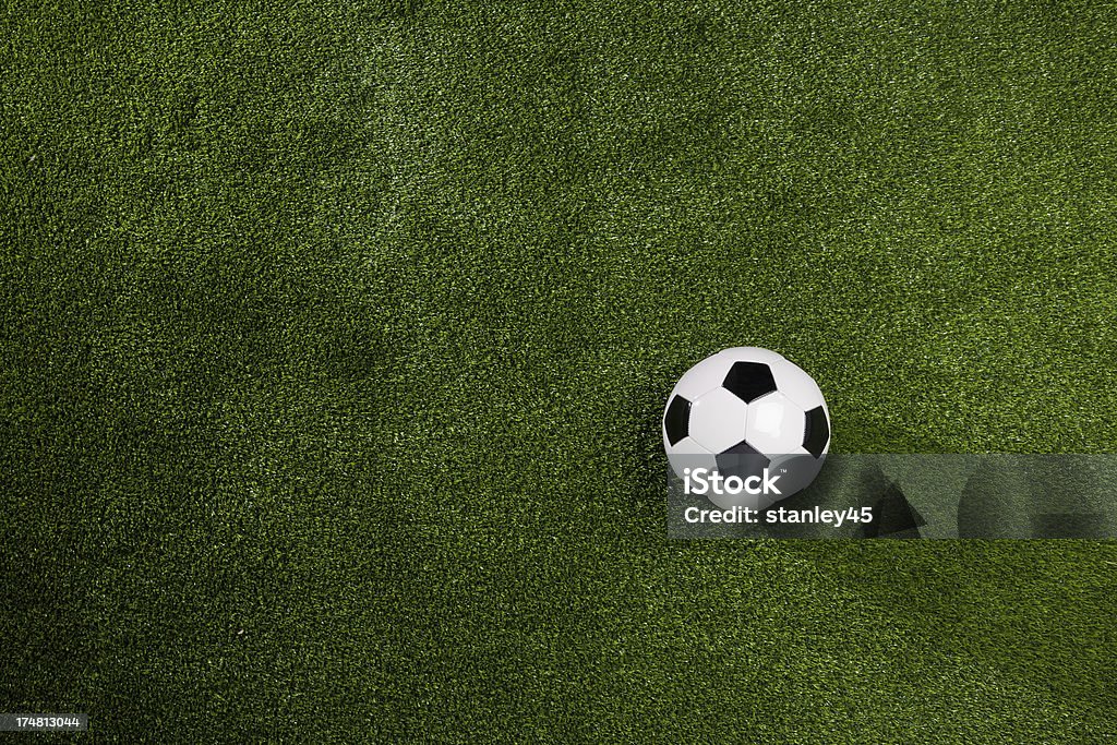 Soccer Ball on Green Grass background Soccer ball on artificial turf with room for copy space.  Add your own message or brand Grass Stock Photo