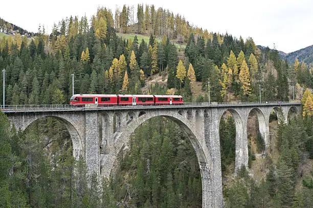 Photo of Red train on the Wiesener-Viaduct, Graubuenden, Switzerland