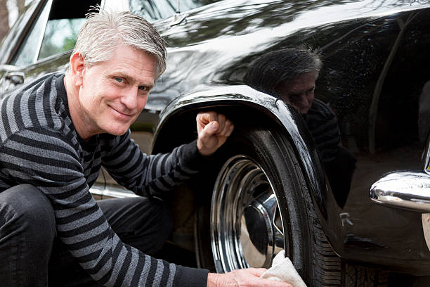 Senior Man Cleaning Car stock photo