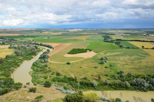 Fertile valley of the river is photographed from above in spring. Guadalquivir  begins in the Cazorla mountain range and passes through Cordoba and Seville.