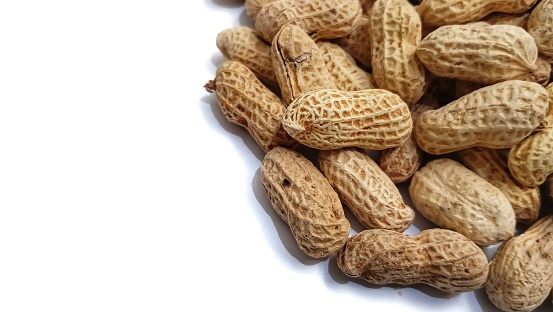 salted roasted peanuts, a healthy snack on white background