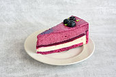 slice of blueberry cake on the saucer isolated close up