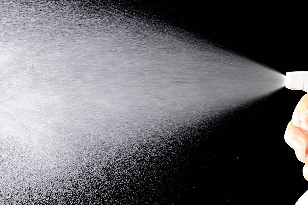 istock Using of a spray nozzle against black background 174814527