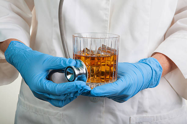 Stethoscope Food Health & Safety Glass of Wiskey hard alcohol stock photo