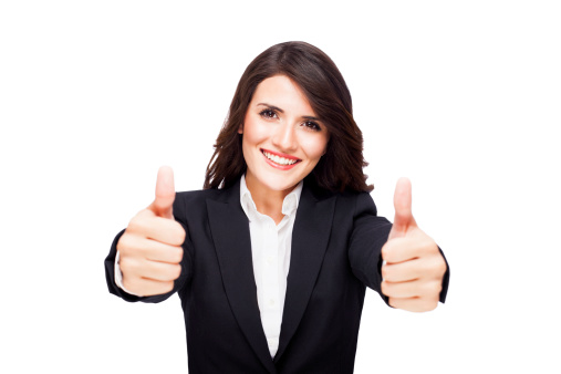 Cheerful business woman making thumbs up