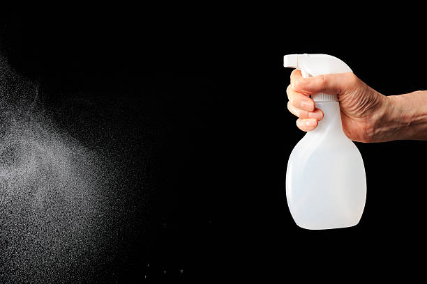 istock Using of spraying nozzle against black background with copy space 174814849