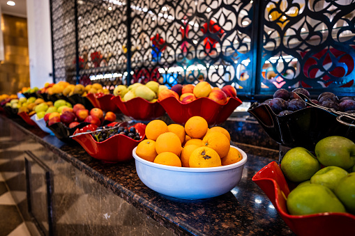 fresh fruits bowl with oranges and apples at an all-inclusive hotel, showcasing the healthy and delicious options available to guests