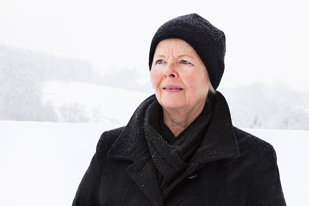 istock senior woman in winter sadness 174814912