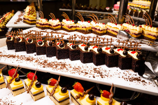 istock variety of sweets including cakes, eclairs and Turkish sweets, arranged beautifully on a table in a luxury all-inclusive hotel. perfect for use in food, travel and luxury related designs 1748149324