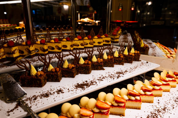 variety of sweets including cakes, eclairs and Turkish sweets, arranged beautifully on a table in a luxury all-inclusive hotel. perfect for use in food, travel and luxury related designs