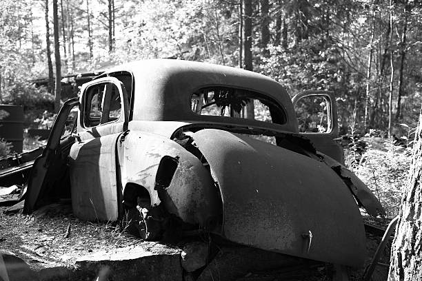 Wreck of a classic car left in a forest to rust!