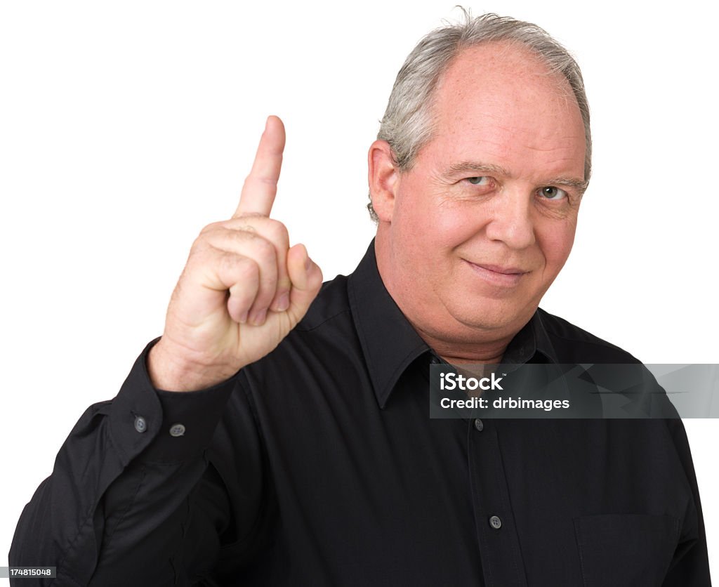 Satisfied Man Gestures Number One Finger Portrait of a mature adult man on a white background. Number 1 Stock Photo