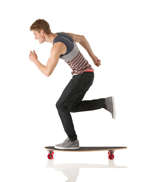 istock Profile of a man skateboarding and smiling 174815142