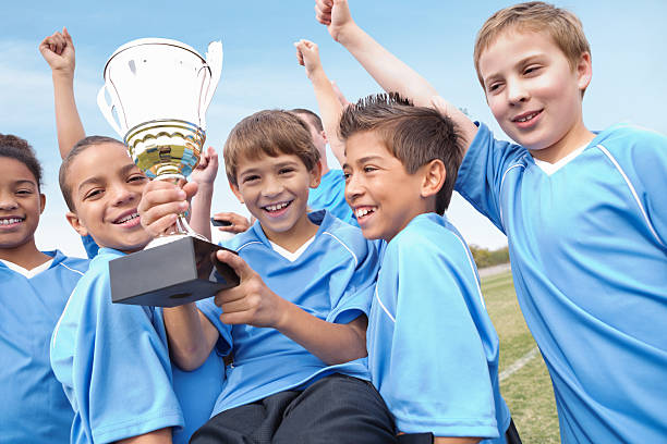 istock Champion youth soccer team with winning trophy! 174815145