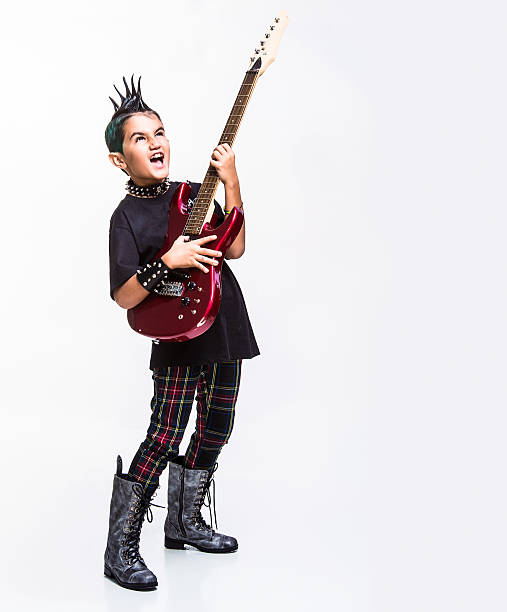istock punk kid playing an electric guitar 174815157