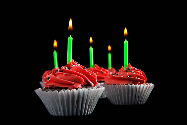 istock Chocolate Cupcake Red Frosting and Candle with Flame 174815410