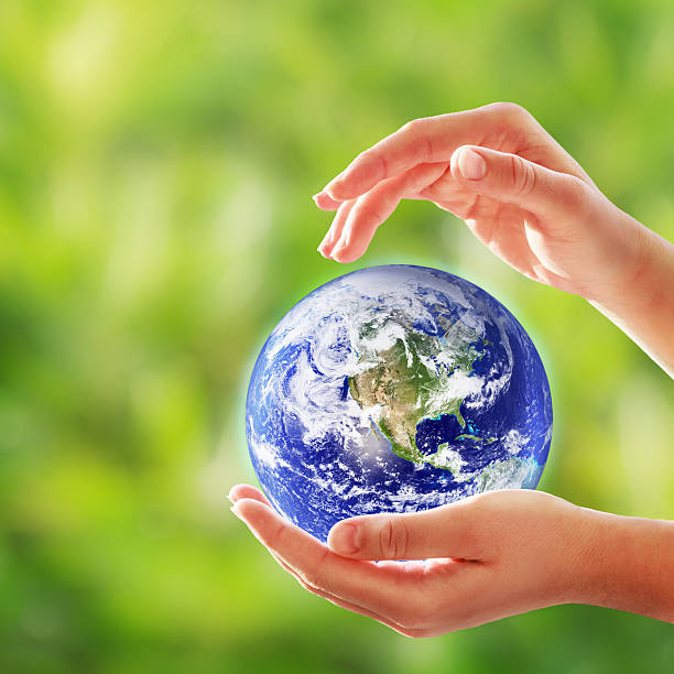 istock Planet Earth In Female Hands 174815619