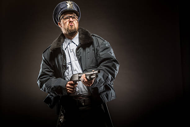 istock Cop in Action with shotgun 174815702