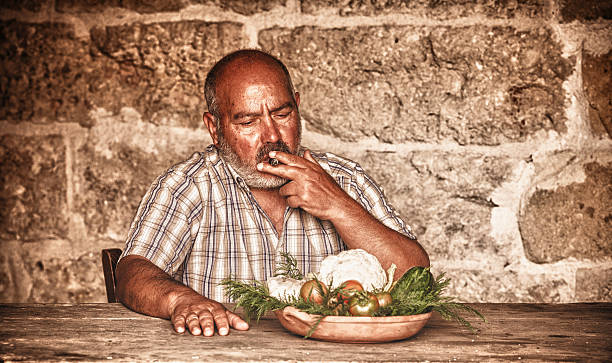 istock Mature adult smoking sitting on the table 174815914