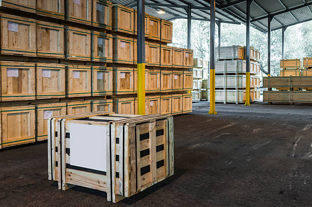 Wooden crates being stored outside.\