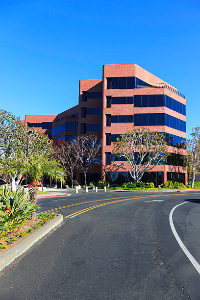 office building außenansicht - office building office park low angle view orange county stock-fotos und bilder