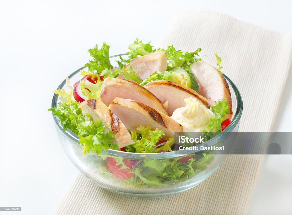 chicken salad with vegetables big chicken salad with fresh vegetables in a glass bowl Barbecue - Meal Stock Photo