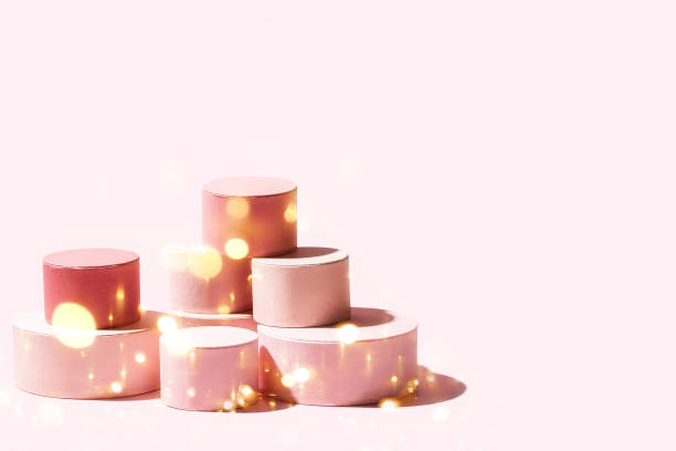 istock Different round gift boxes on pink pastel background with beautiul sparkling bokeh Giving surprise present, sale cocnept 1748172252