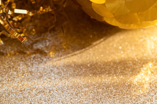istock Abstract festive background with shine and glowing gold particles and circles on beige sparkling background. Party, wedding, Christmas and etc beauty backdrop 1748172264