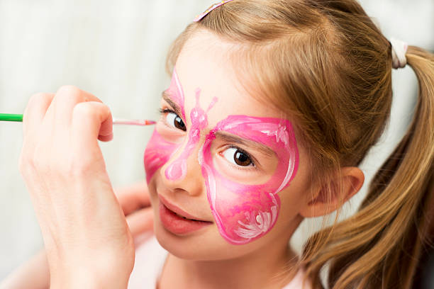 istock Girl enjoying face painting 174817248