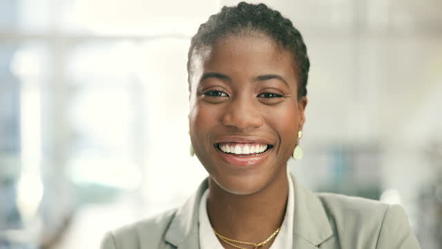 Face, business and happy black woman in corporate workplace, office and company. Portrait, smile and professional African lawyer, attorney and female worker in Nigeria for consultant career or job