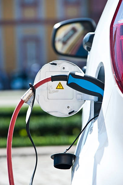 istock charge white electric car - view from behind 174817485