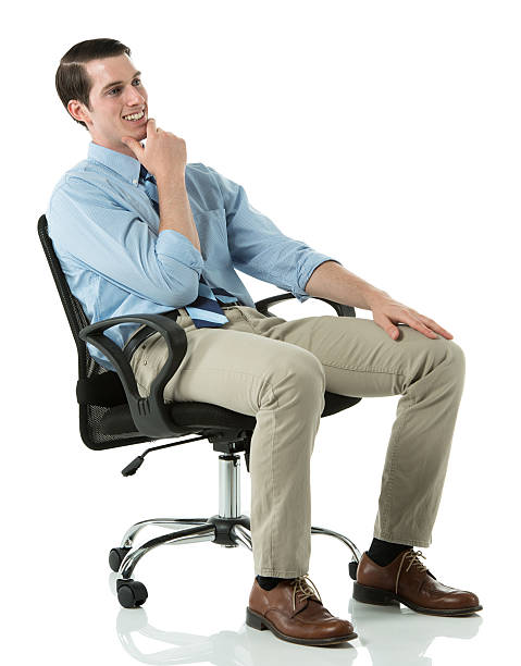 istock Smiling businessman sitting in a chair 174817602