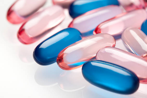 istock Pink and blue gel pills 174817957