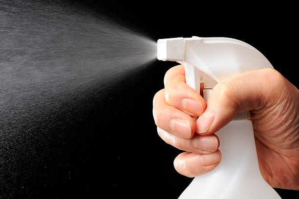 istock Using of a spray nozzle against black background 174817958