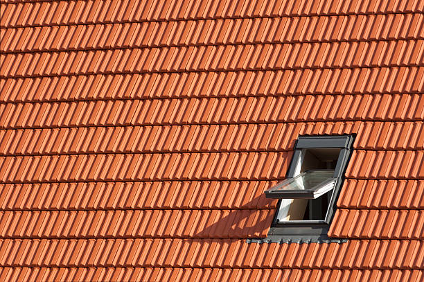 Roof with window, rooftiles stock photo